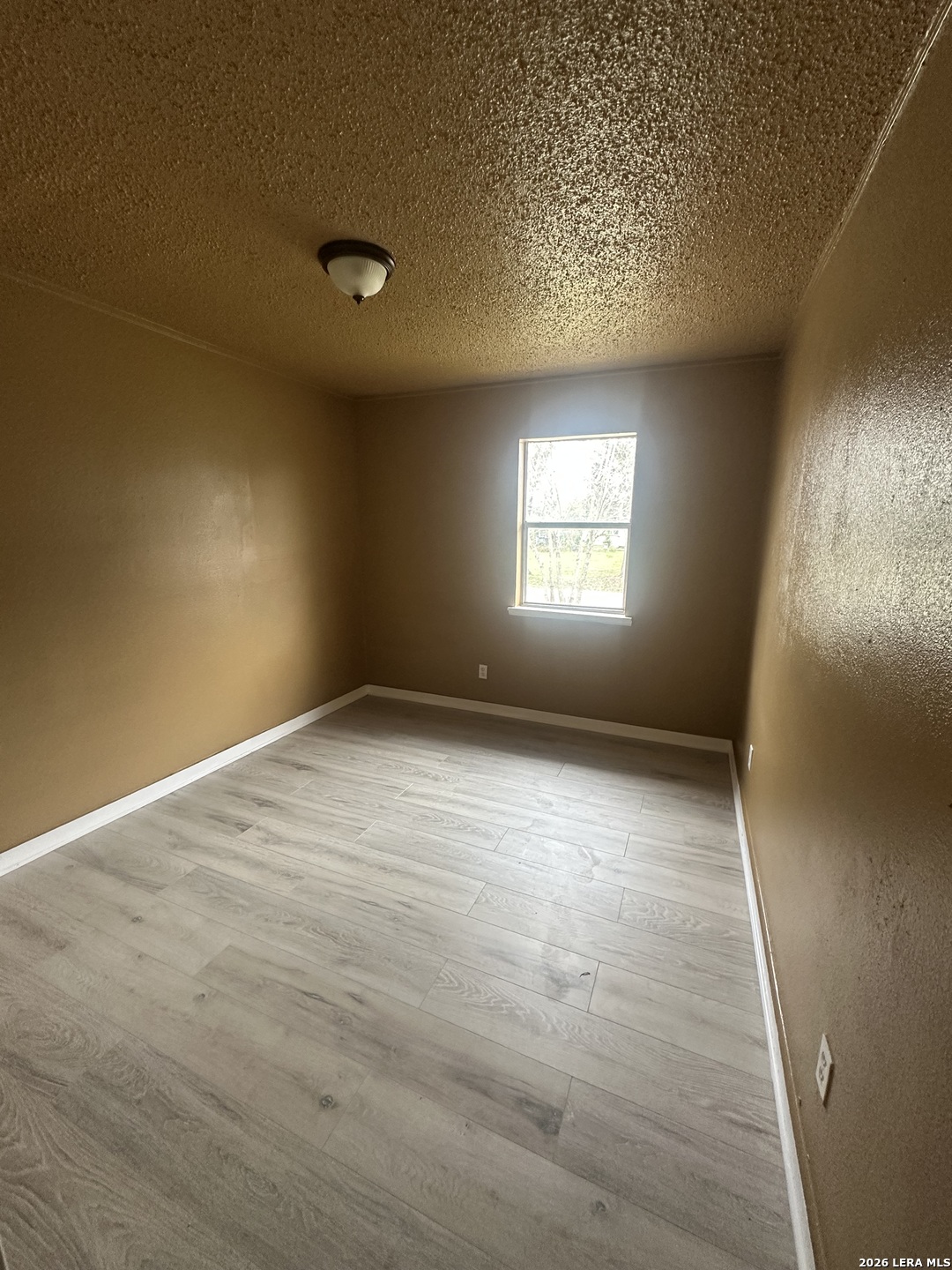 510 Riley Street Seguin, TX 78155 - Photo 9 of 24 an empty room with windows