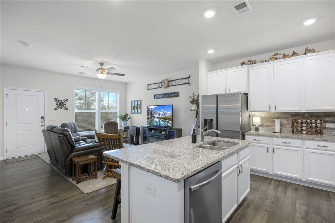 339 Village Boundary Anderson, SC 29621 - Photo 11 of 36 This inviting space combines a well-appointed kitchen and comfortable living area, perfect for everyday living.