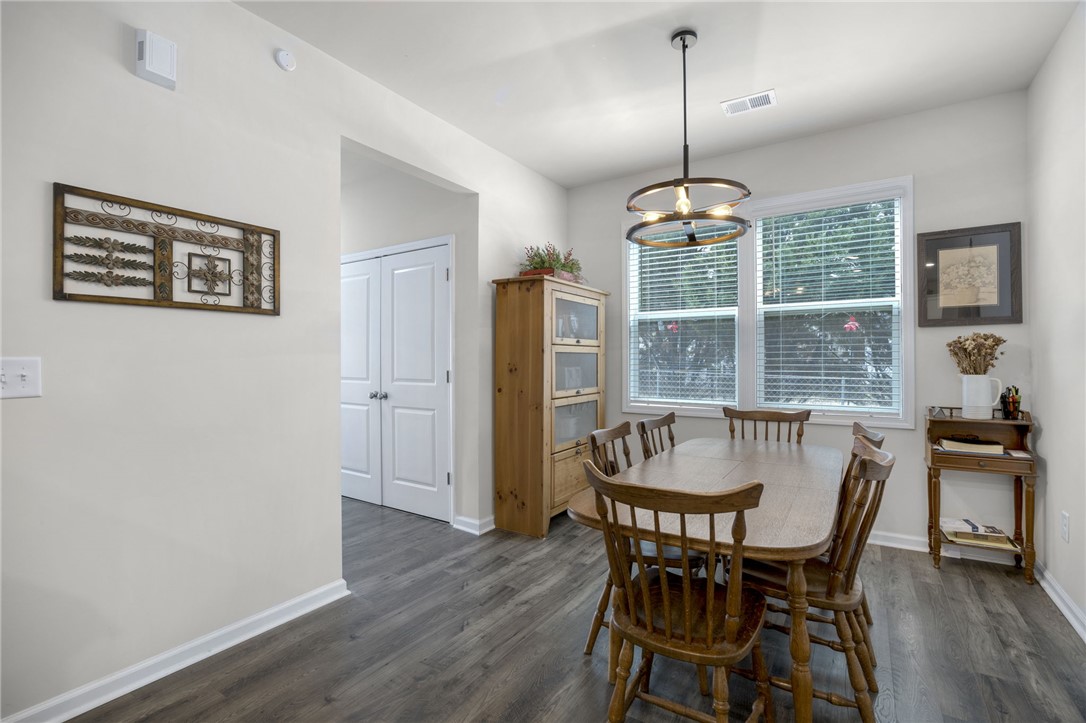 339 Village Boundary Anderson, SC 29621 - Photo 12 of 36 This bright dining area features ample natural light and durable flooring, perfect for everyday living.