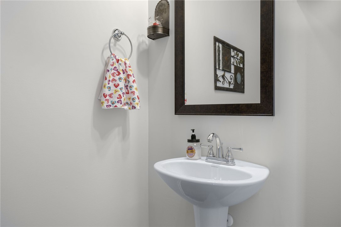 339 Village Boundary Anderson, SC 29621 - Photo 14 of 36 This bathroom features a contemporary pedestal sink and a sleek framed mirror.