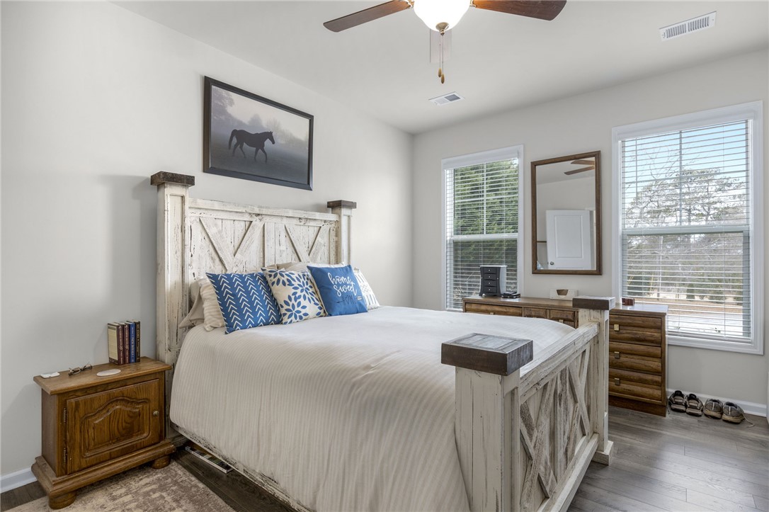 339 Village Boundary Anderson, SC 29621 - Photo 16 of 36 This spacious bedroom offers comfortable living with ample natural light.
