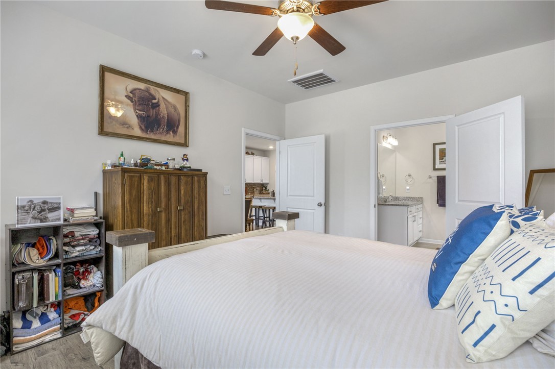 339 Village Boundary Anderson, SC 29621 - Photo 17 of 36 This spacious bedroom offers comfortable living with convenient access to an adjoining bathroom.