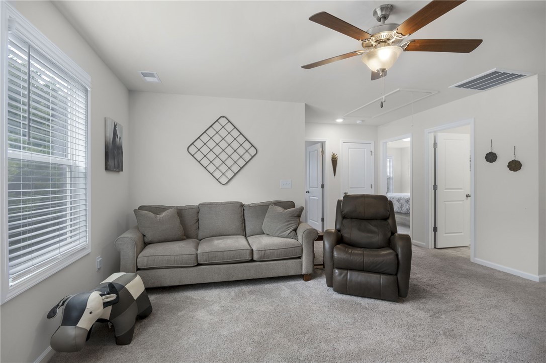 339 Village Boundary Anderson, SC 29621 - Photo 20 of 36 This bright living space features soft carpeting and ample natural light, ideal for everyday living.