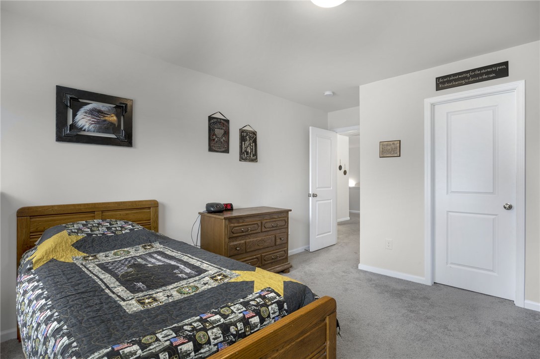 339 Village Boundary Anderson, SC 29621 - Photo 24 of 36 This cozy bedroom features plush carpeting and classic wooden furnishings, creating a comfortable retreat.
