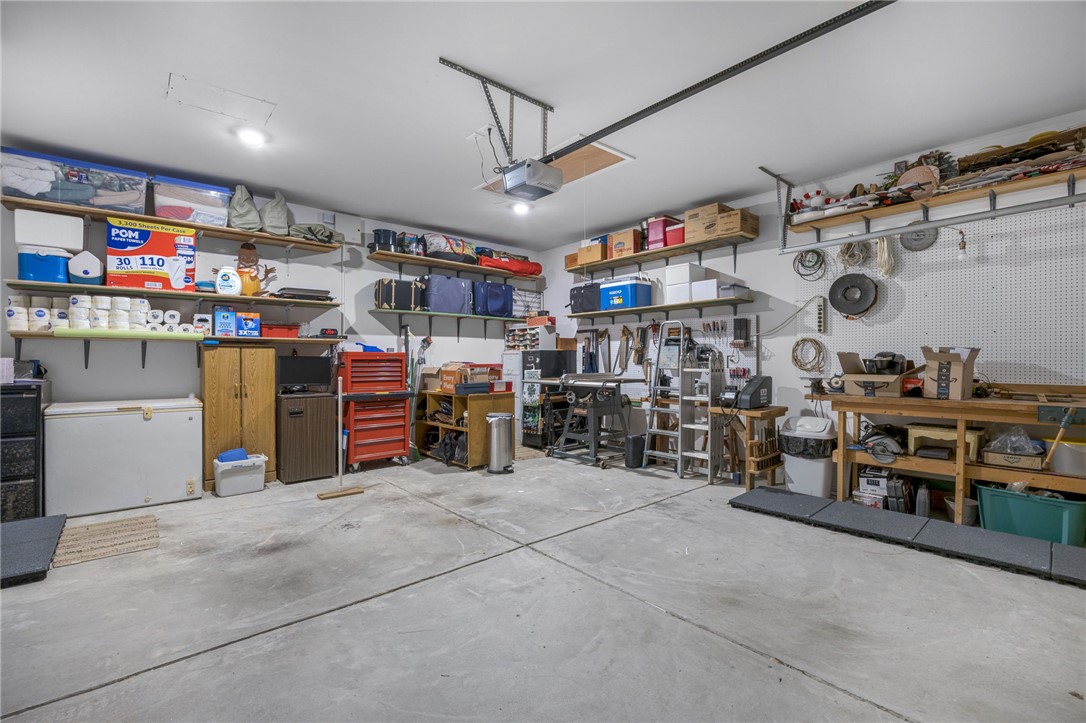 339 Village Boundary Anderson, SC 29621 - Photo 26 of 36 This spacious garage offers ample storage and workspace, perfect for projects or organization.