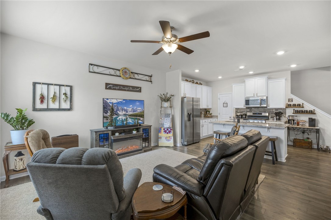 339 Village Boundary Anderson, SC 29621 - Photo 5 of 36 This open-concept living area seamlessly connects to a contemporary kitchen, perfect for comfortable living and entertaining.