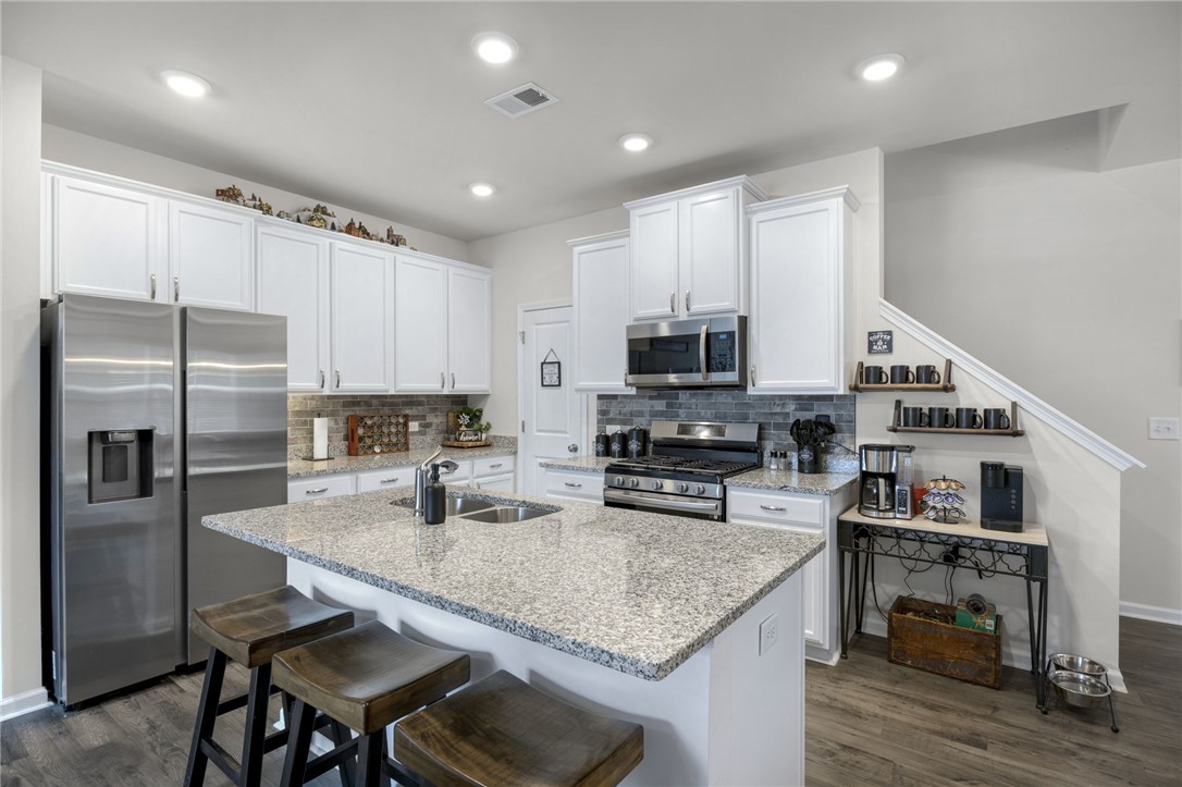 339 Village Boundary Anderson, SC 29621 - Photo 9 of 36 This kitchen showcases a functional layout and ample counter space, perfect for culinary endeavors.