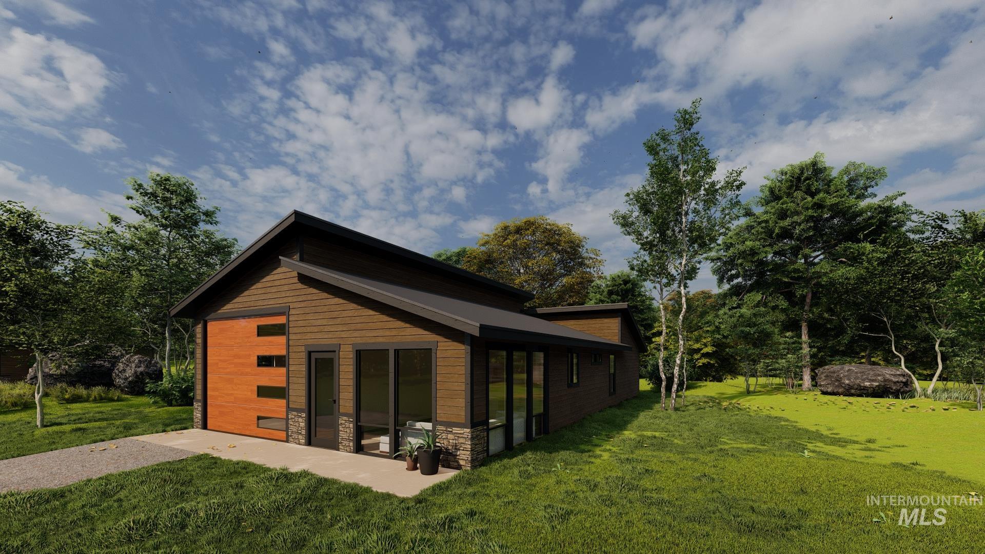 View of home's exterior featuring stone siding and a lawn