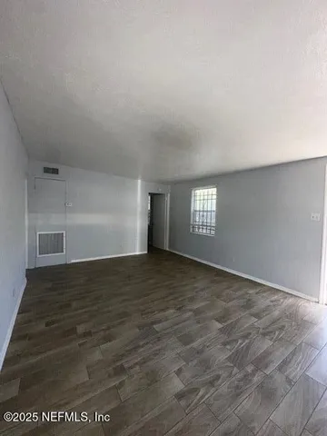 a view of an empty room and window