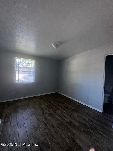 3254 Phyllis Street Jacksonville, FL 32205 - Photo 9 of 11 an empty room with wooden floor and windows