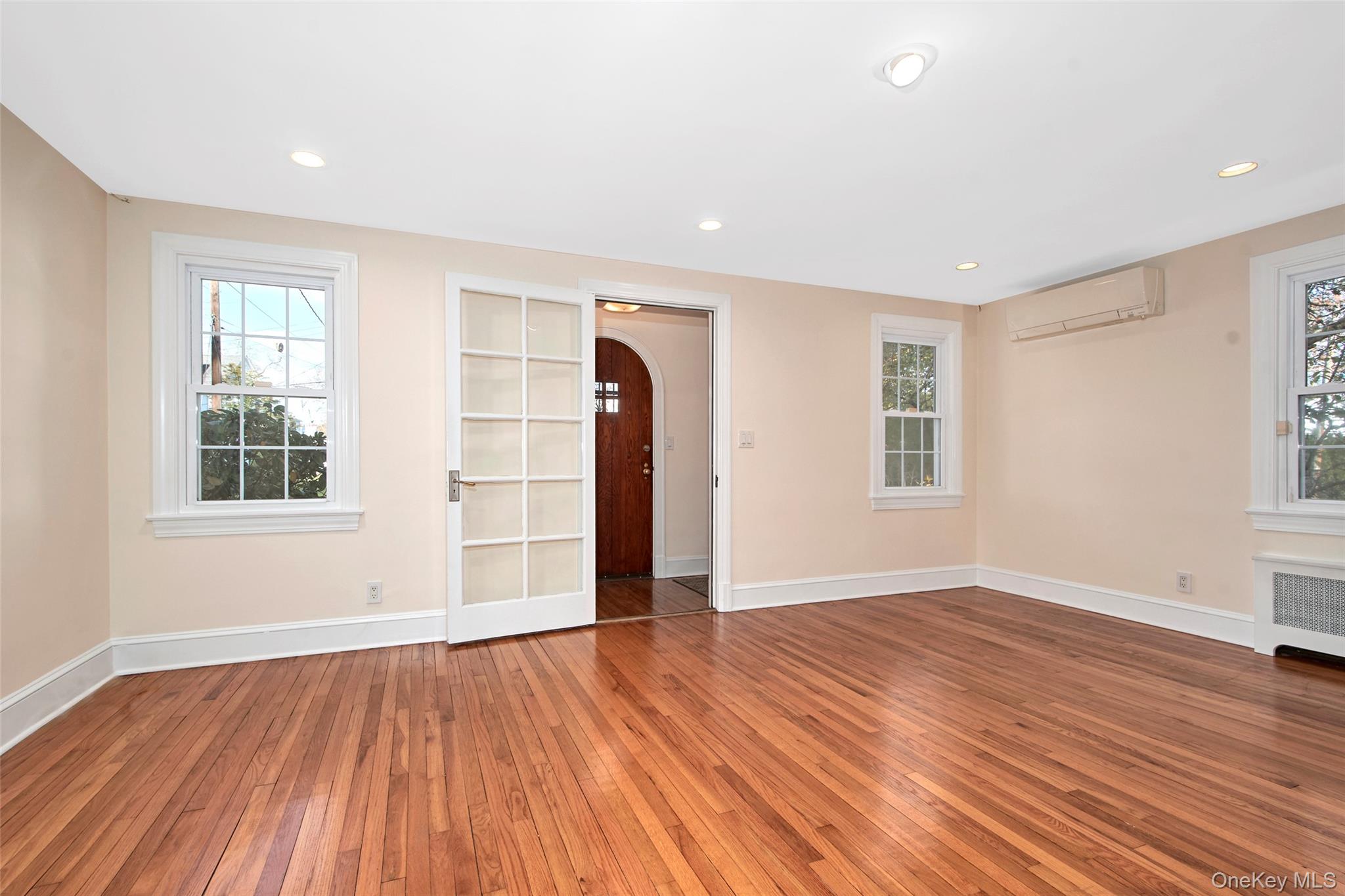 17 Haven Avenue Rye, NY 10580 - Photo 13 of 34 an empty room with wooden floor and windows