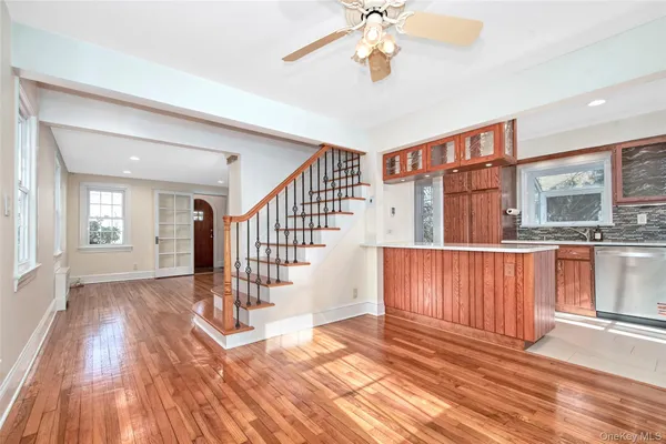 a view of entryway and hall with wooden floor