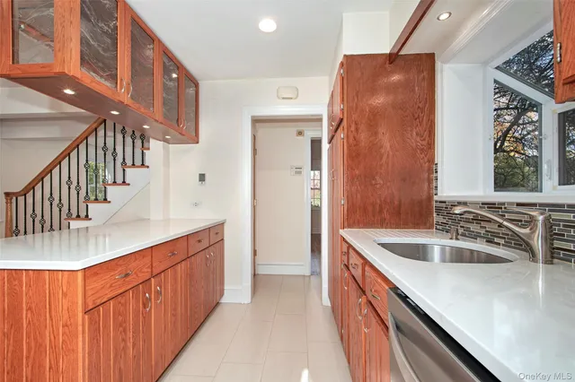 a kitchen with sink cabinets and stove