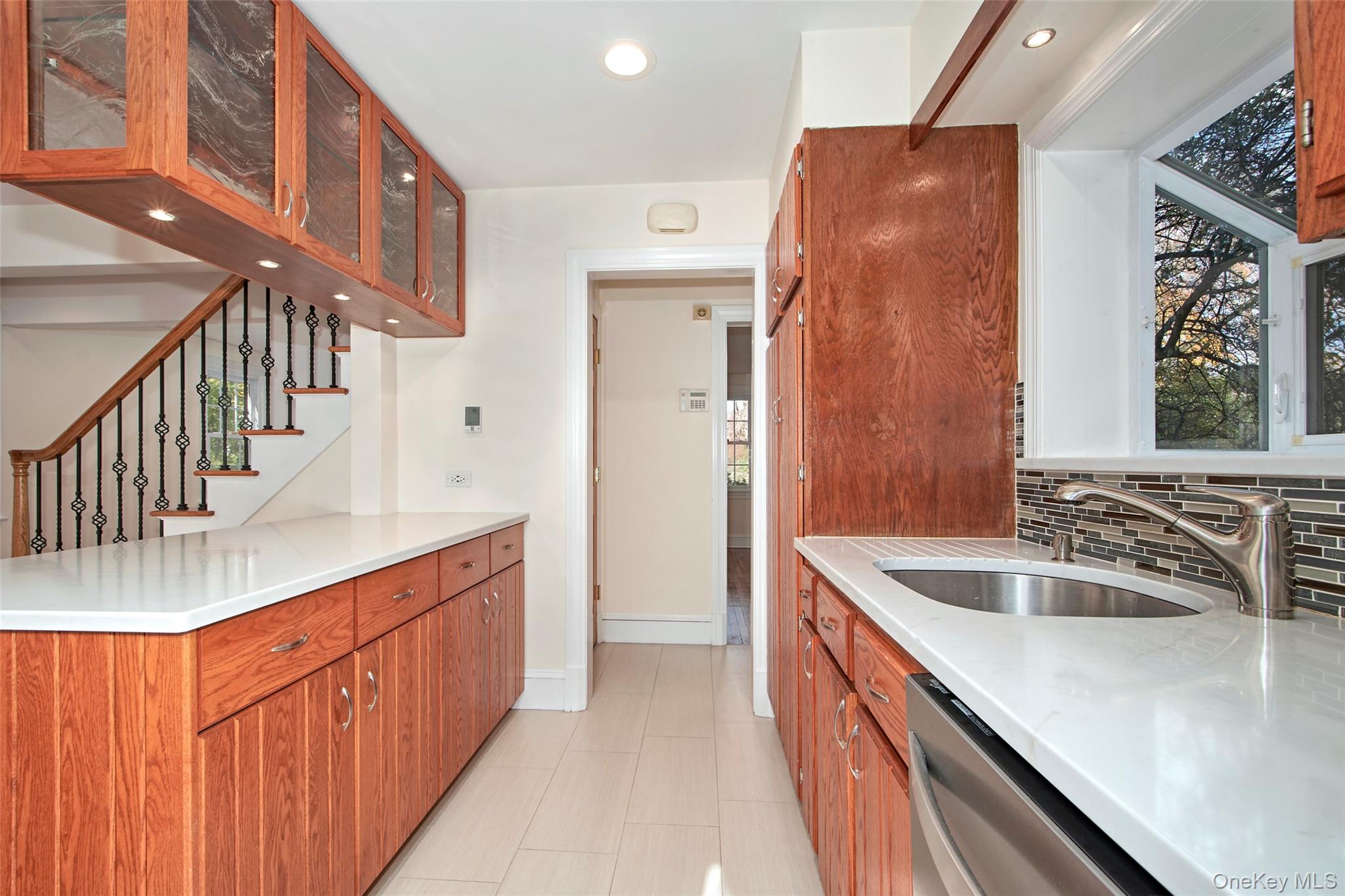 17 Haven Avenue Rye, NY 10580 - Photo 19 of 34 a kitchen with sink cabinets and stove