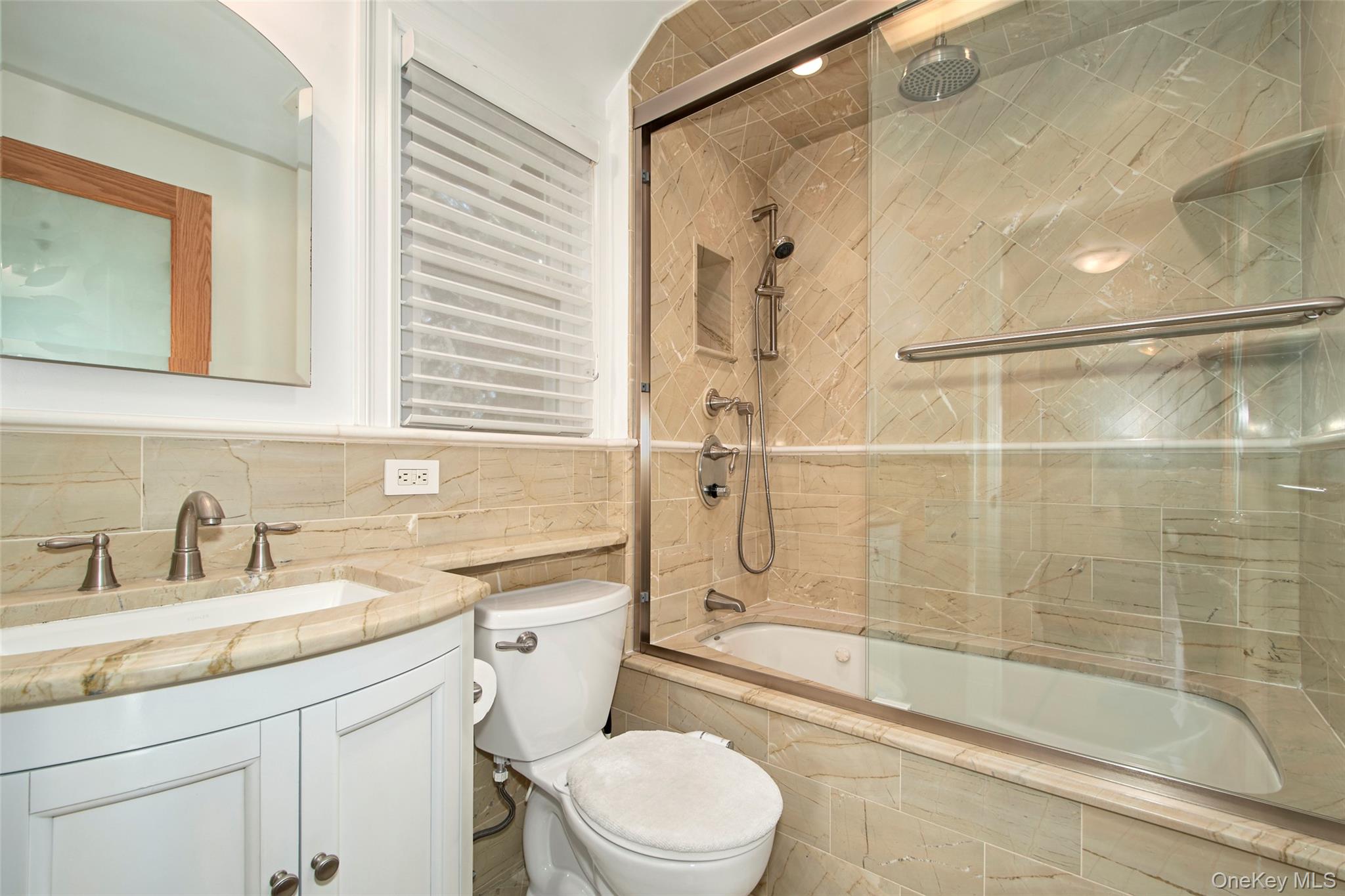 17 Haven Avenue Rye, NY 10580 - Photo 22 of 34 a bathroom with a sink a toilet and shower
