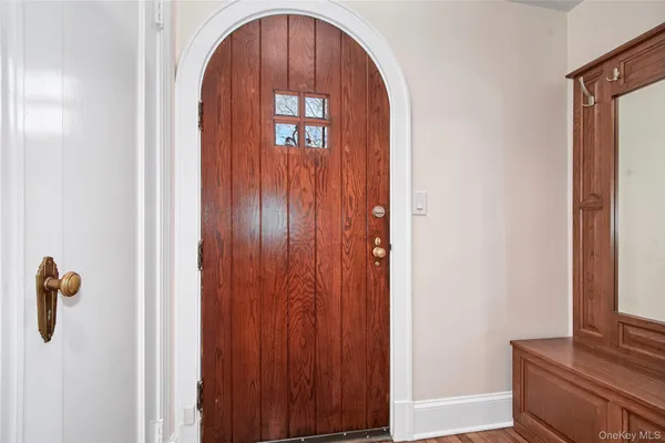 a view of entryway with wooden floor