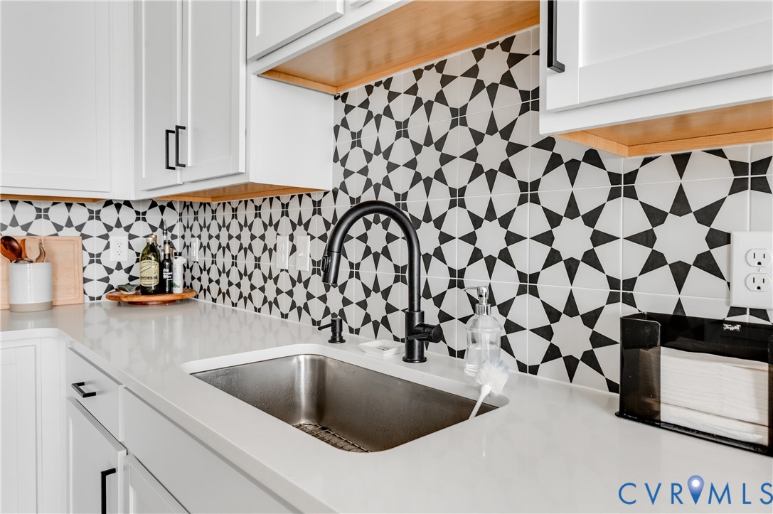 1900 Roseneath Road, Unit 8B Richmond, VA 23230 - Photo 17 of 50 Kitchen featuring white cabinetry, light stone cou