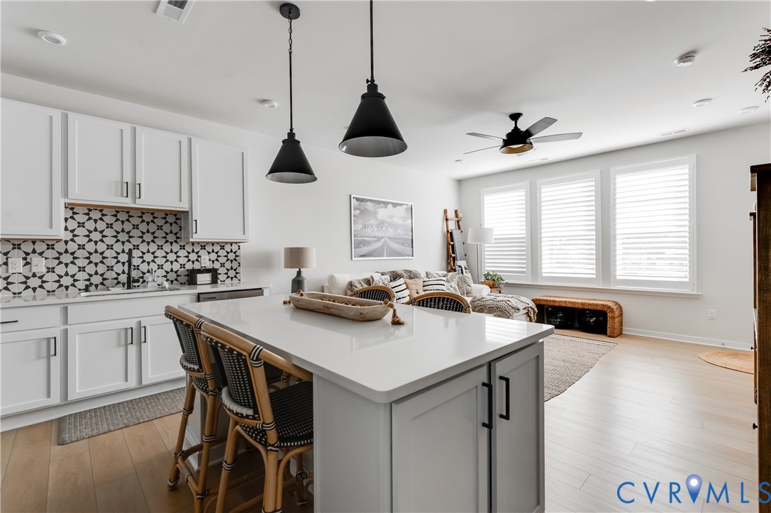 1900 Roseneath Road, Unit 8B Richmond, VA 23230 - Photo 19 of 50 Kitchen featuring hanging light fixtures, white ca