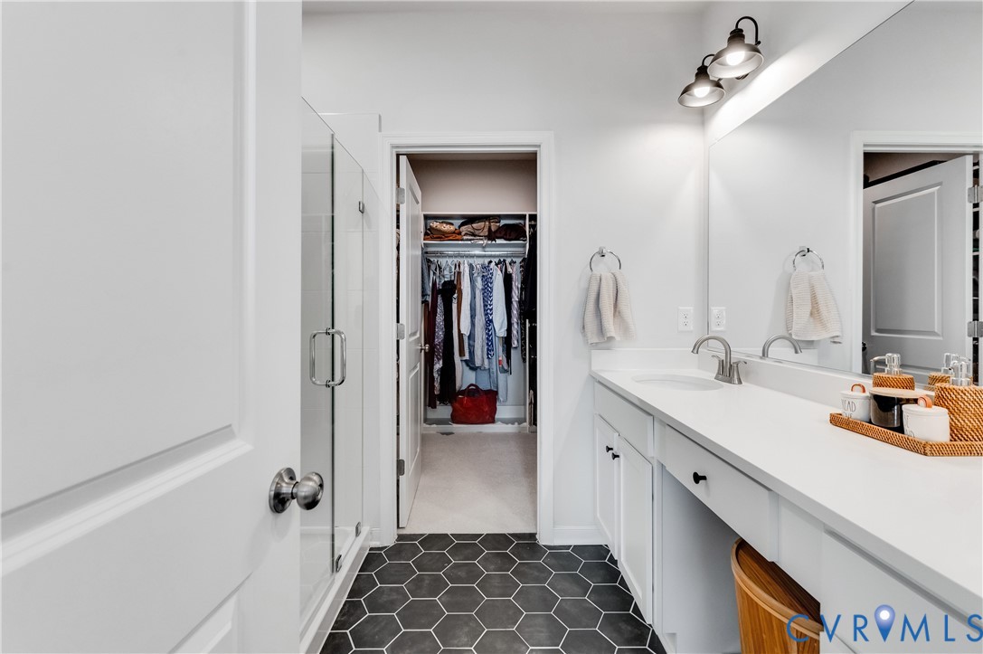 1900 Roseneath Road, Unit 8B Richmond, VA 23230 - Photo 27 of 50 Bathroom with a walk in closet, vanity, a shower s