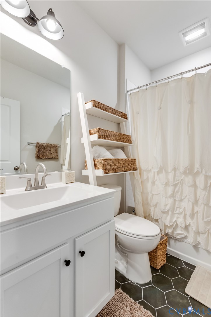 1900 Roseneath Road, Unit 8B Richmond, VA 23230 - Photo 36 of 50 Bathroom with dark tile patterned floors, vanity,