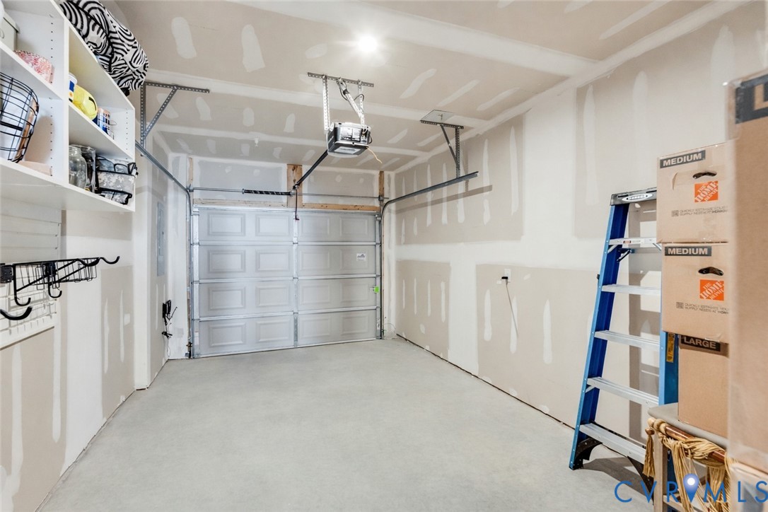 1900 Roseneath Road, Unit 8B Richmond, VA 23230 - Photo 41 of 50 Garage featuring a garage door opener