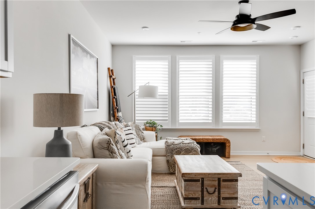 1900 Roseneath Road, Unit 8B Richmond, VA 23230 - Photo 5 of 50 Living area featuring ceiling fan and light wood-s