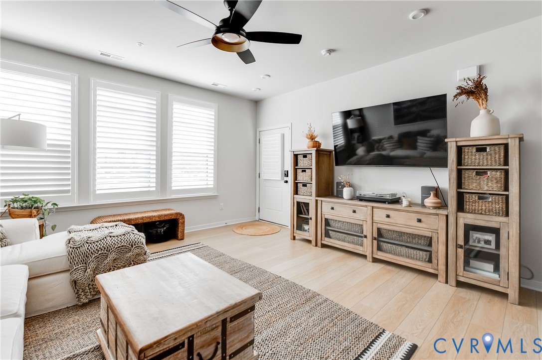 1900 Roseneath Road, Unit 8B Richmond, VA 23230 - Photo 6 of 50 Living room featuring a ceiling fan and light wood