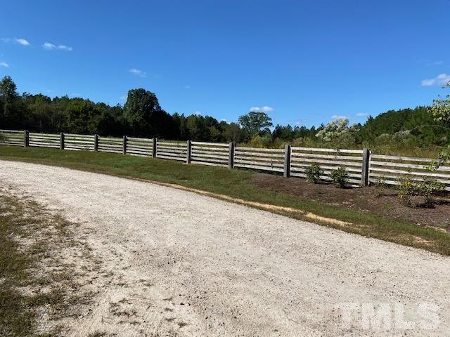 7252 Shawan Road Wendell, NC 27591 - Photo 6 of 20 Storage shed w/converted workshop under lean-to and a screened area on the other side