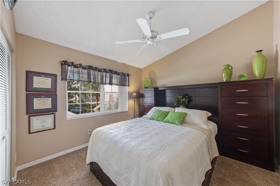 14995 Rivers Edge Court, Unit 250 Fort Myers, FL 33908 - Photo 14 of 19 a bedroom with a bed and window