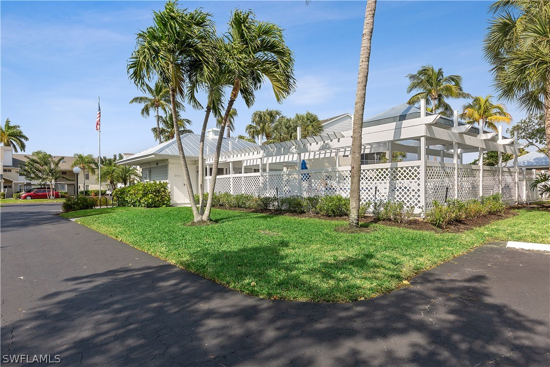 14995 Rivers Edge Court, Unit 250 Fort Myers, FL 33908 - Photo 17 of 19 a front view of a house with garden