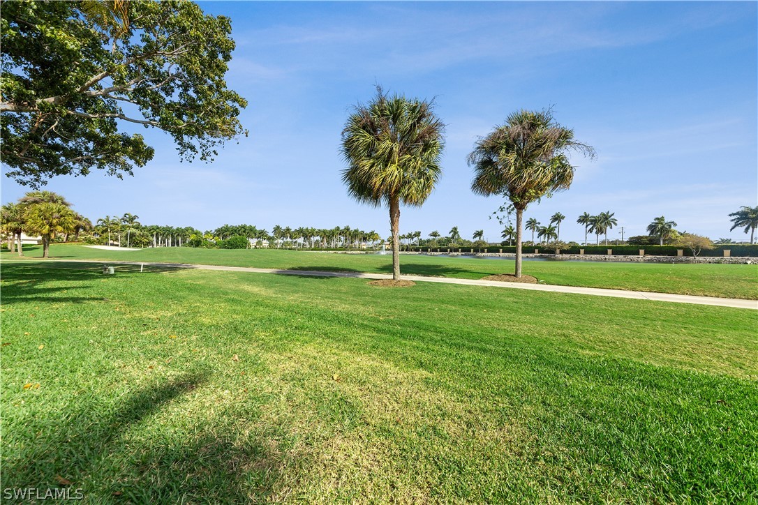14995 Rivers Edge Court, Unit 250 Fort Myers, FL 33908 - Photo 18 of 19 a view of a golf course with a big yard