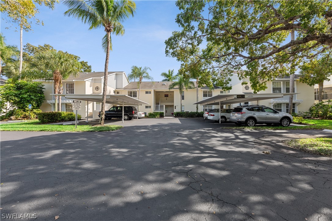 14995 Rivers Edge Court, Unit 250 Fort Myers, FL 33908 - Photo 19 of 19 a car parked in front of a house