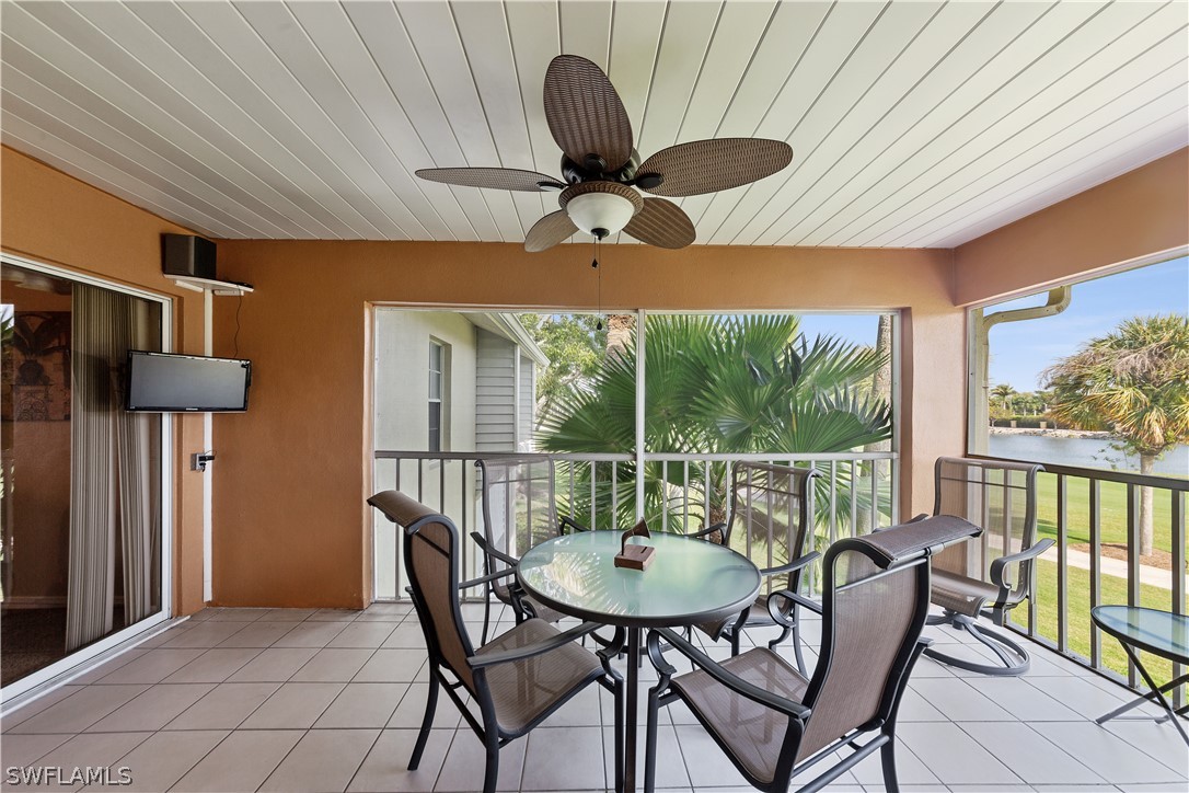 14995 Rivers Edge Court, Unit 250 Fort Myers, FL 33908 - Photo 6 of 19 a dining room with furniture and a floor to ceiling window