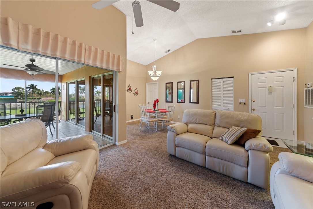 14995 Rivers Edge Court, Unit 250 Fort Myers, FL 33908 - Photo 7 of 19 a living room with furniture a ceiling fan and a window