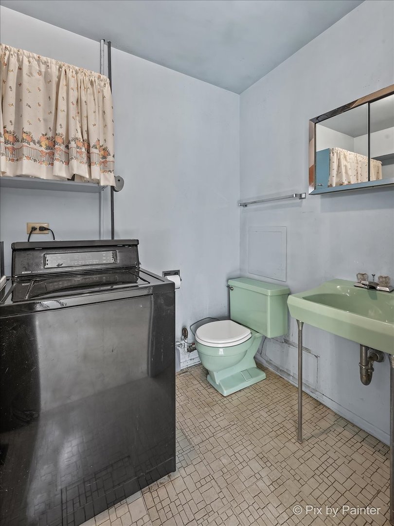 1645 Chippendale Road Hoffman Estates, IL 60169 - Photo 11 of 22 a view of bathroom with a toilet sink and mirror