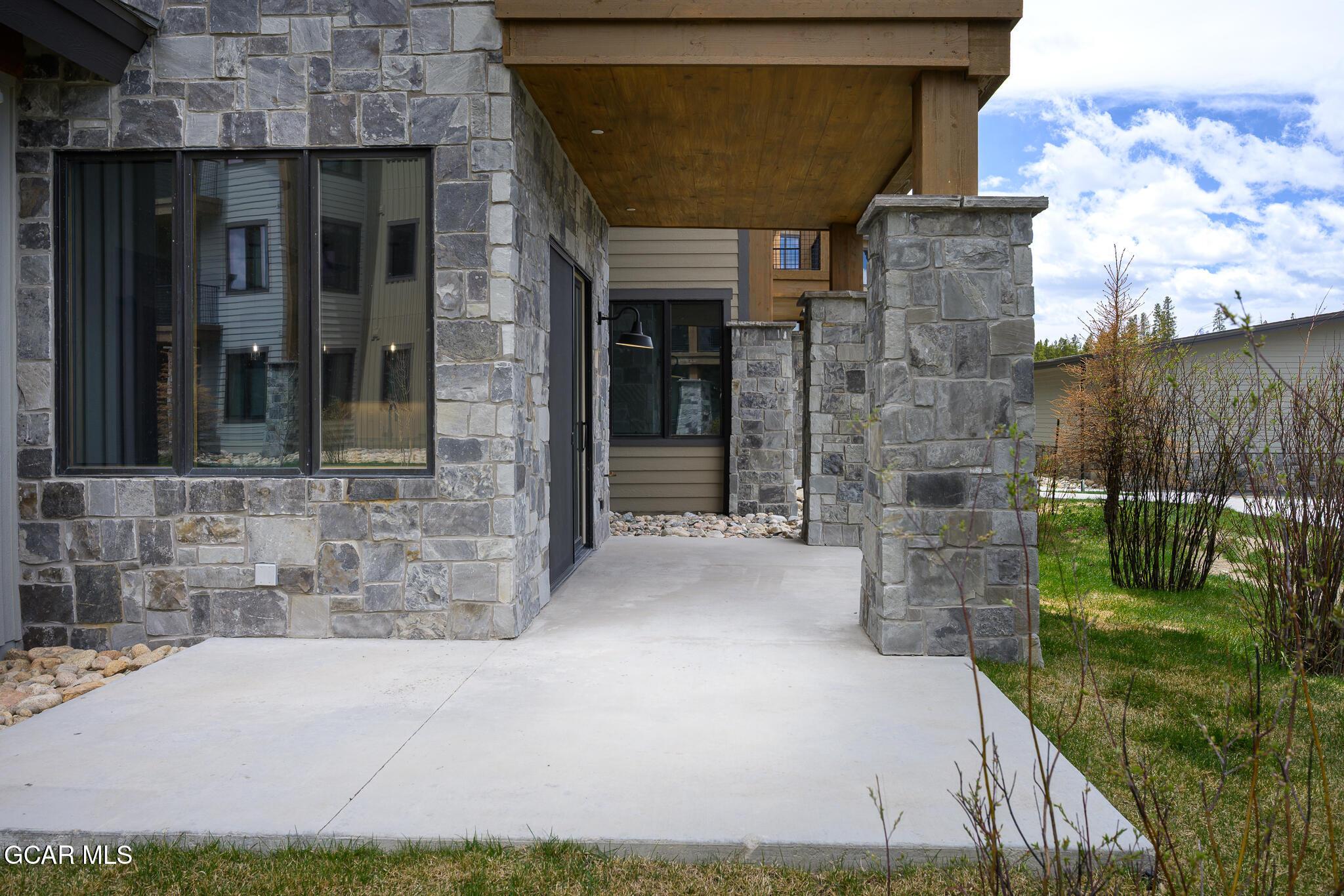 72 Meadow Trail, Unit F101 Fraser, CO 80442 - Photo 17 of 19 a view of brick house with a yard
