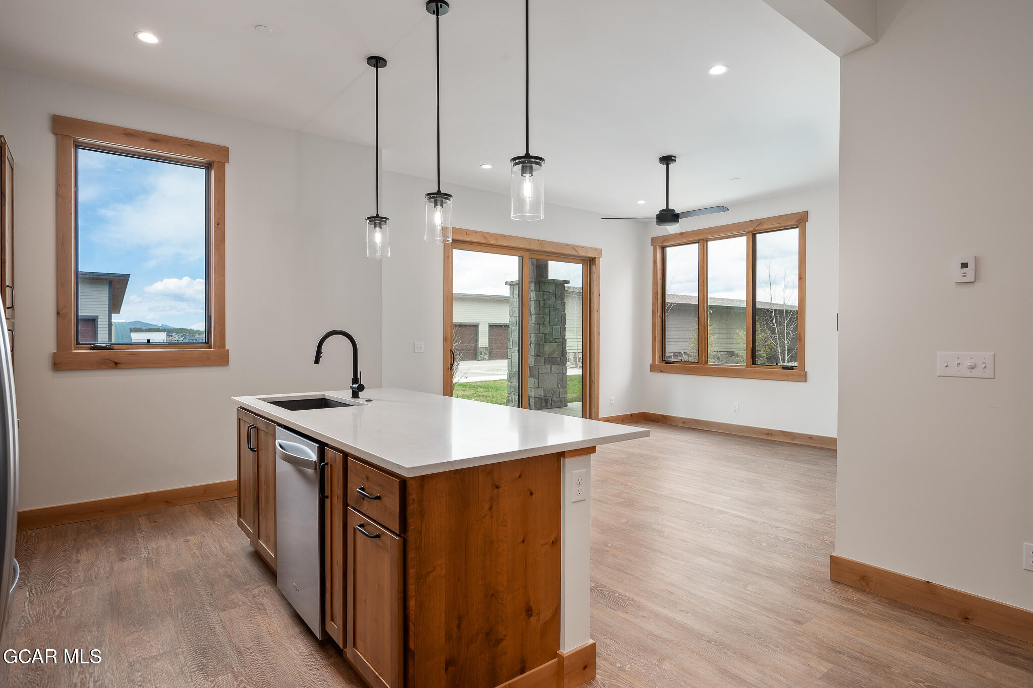 72 Meadow Trail, Unit F101 Fraser, CO 80442 - Photo 4 of 19 a kitchen that has a sink a window and stainless steel appliances