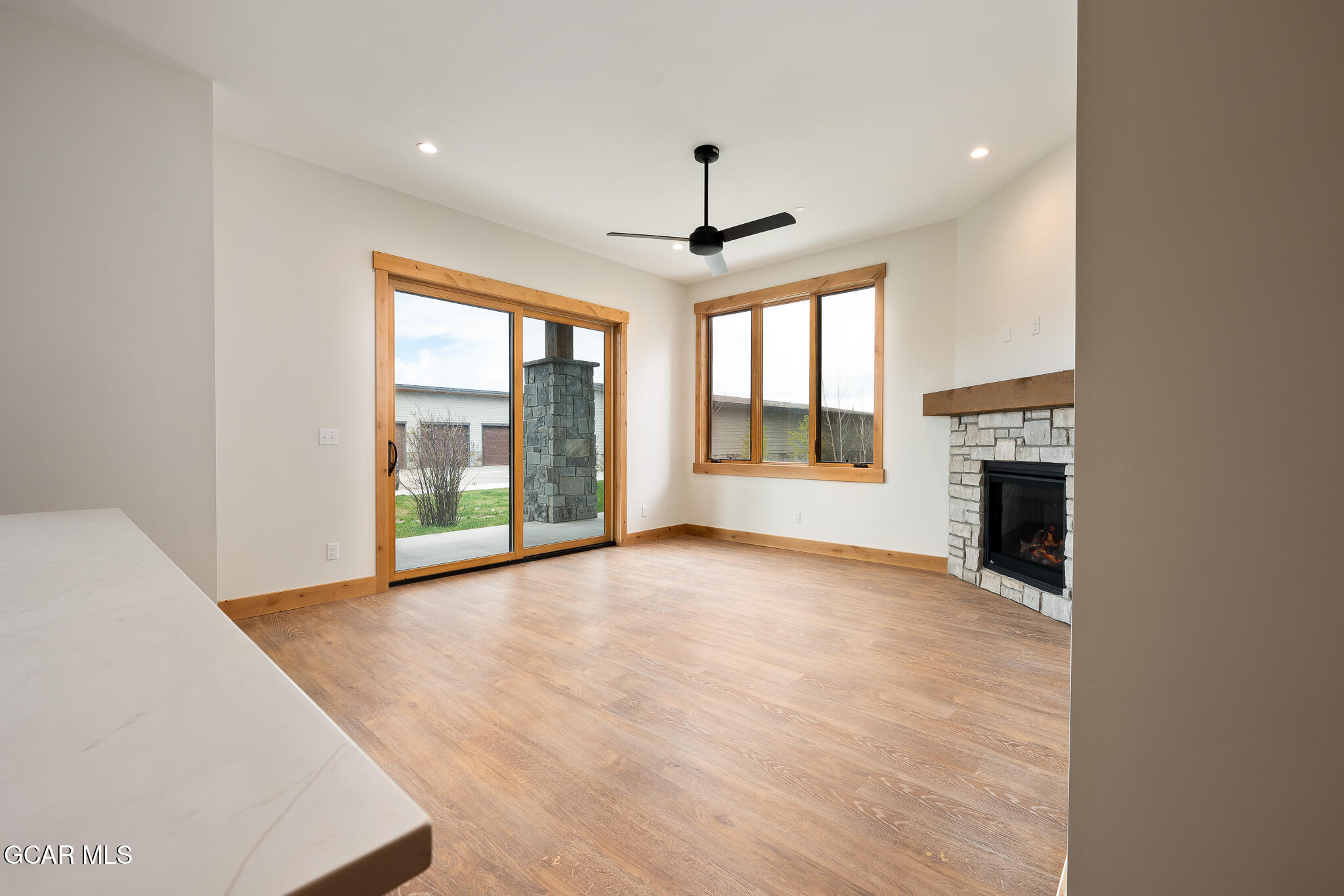 72 Meadow Trail, Unit F101 Fraser, CO 80442 - Photo 5 of 19 a view of an empty room with a fireplace and a window