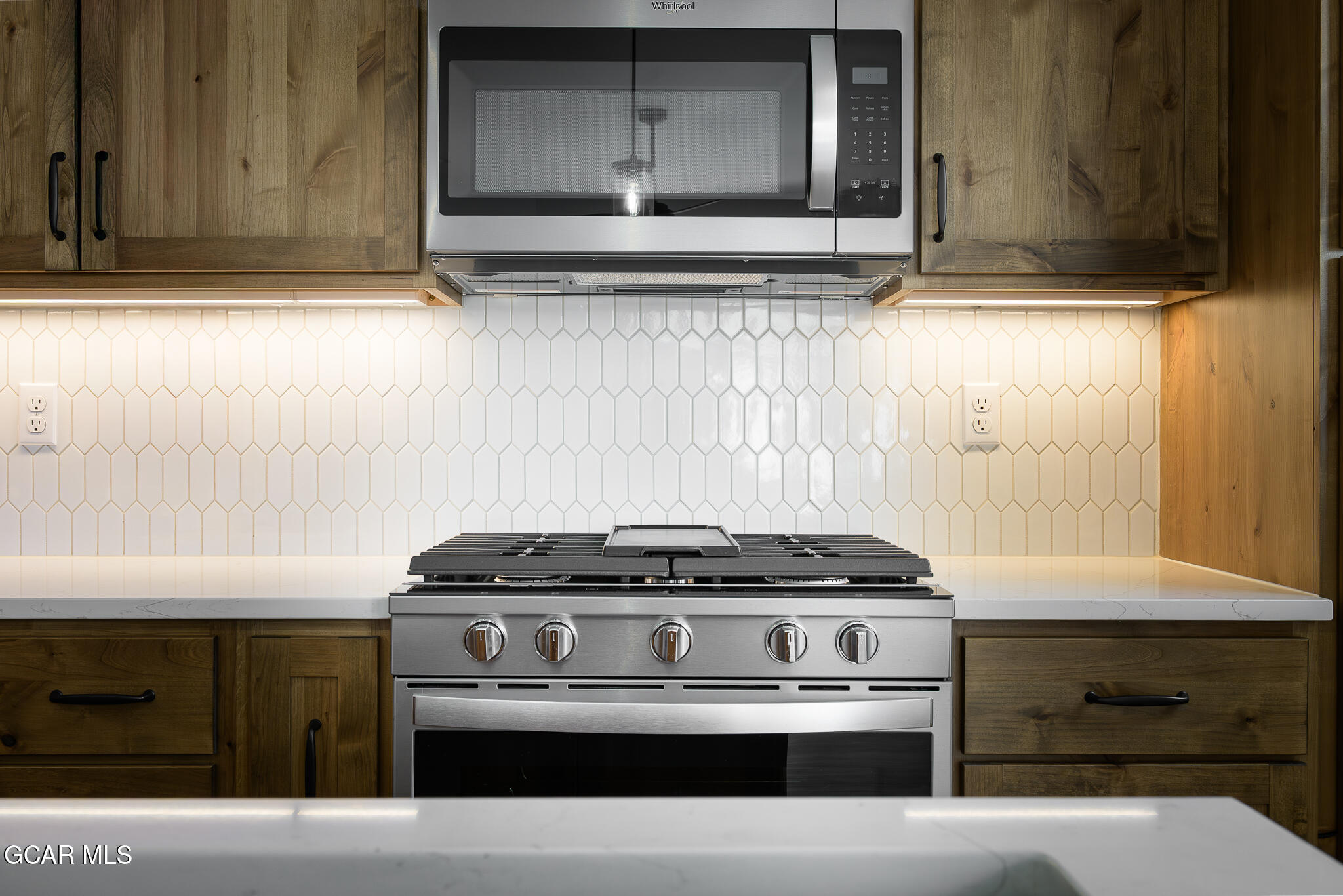 72 Meadow Trail, Unit F101 Fraser, CO 80442 - Photo 7 of 19 a stove top oven sitting inside of a kitchen