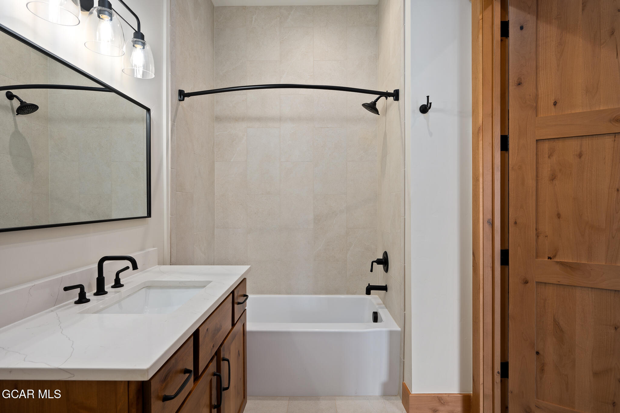 72 Meadow Trail, Unit F101 Fraser, CO 80442 - Photo 10 of 19 a bathroom with a sink and a shower