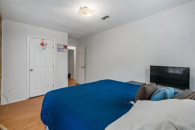 a living room with a bed furniture and a window
