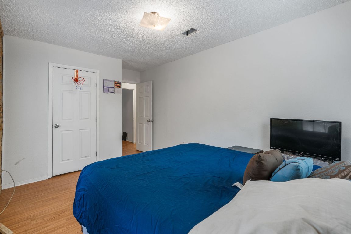 950 County Road 481 Thrall, TX 76578 - Photo 13 of 25 a bedroom with a bed and a flat screen tv