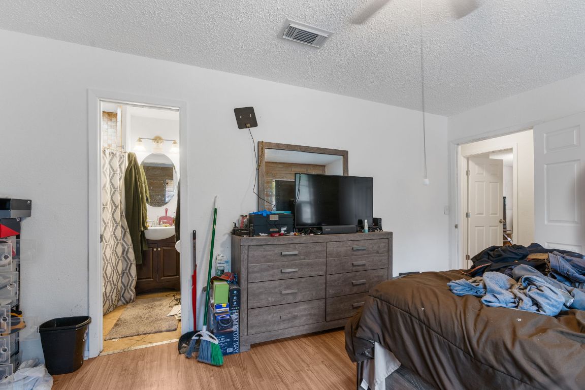 950 County Road 481 Thrall, TX 76578 - Photo 16 of 25 a bedroom with a bed and flat screen tv