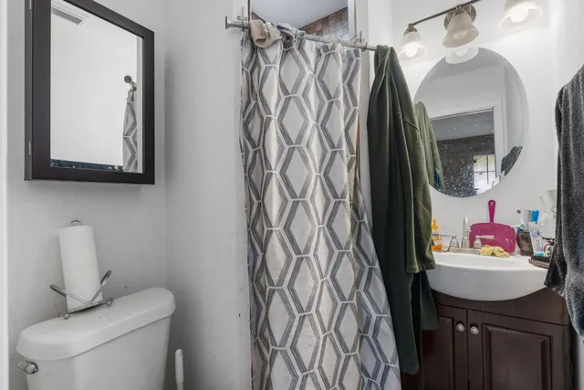 a bedroom with a bed and flat screen tv