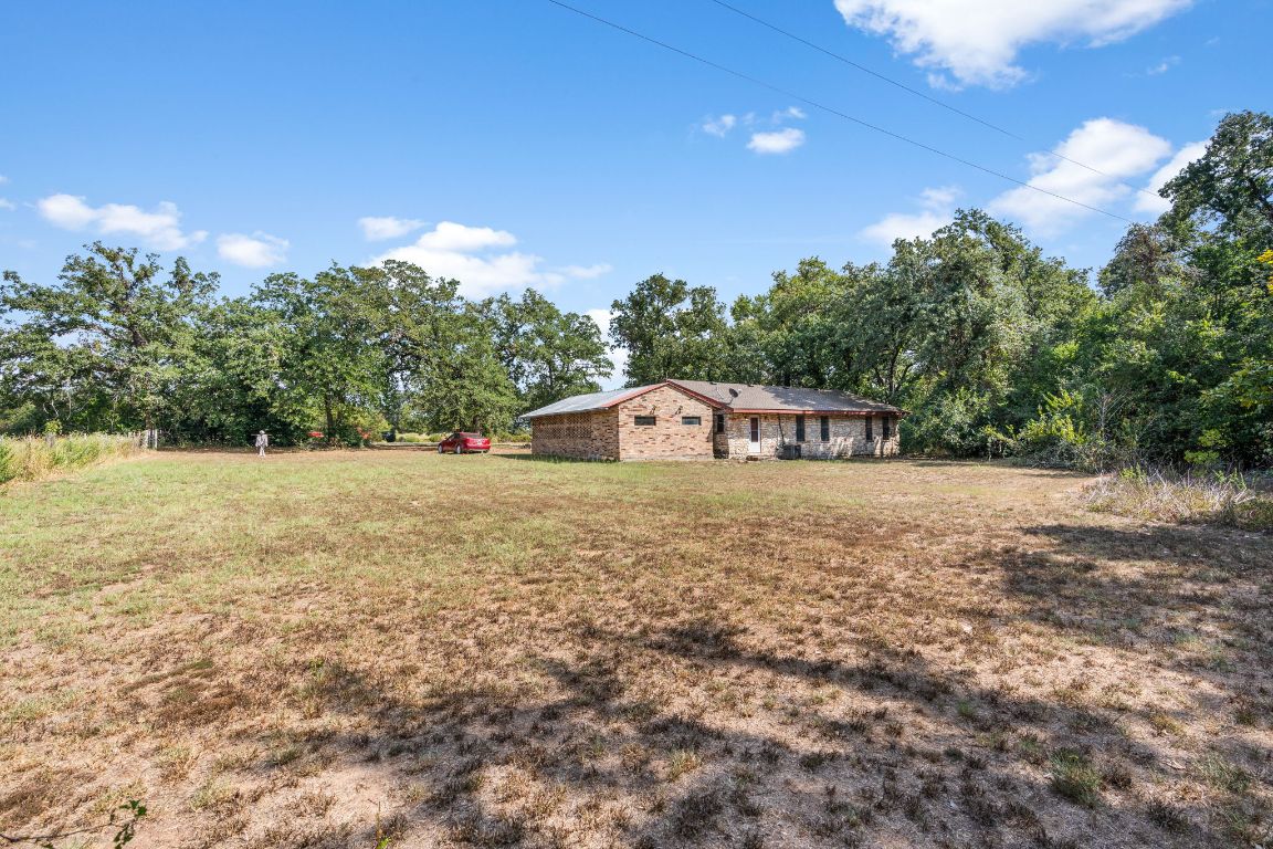 950 County Road 481 Thrall, TX 76578 - Photo 21 of 25 a view of a house with a yard