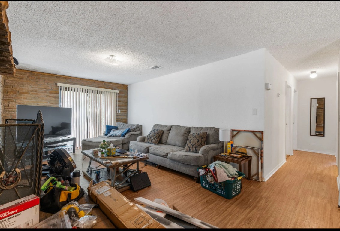 950 County Road 481 Thrall, TX 76578 - Photo 3 of 25 a living room with furniture and a flat screen tv