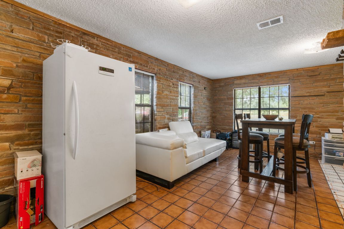 950 County Road 481 Thrall, TX 76578 - Photo 8 of 25 a living room with furniture and a dining table