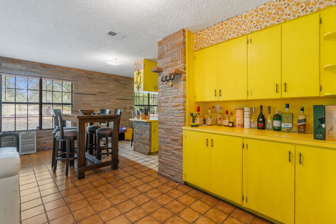 950 County Road 481 Thrall, TX 76578 - Photo 9 of 25 a kitchen with counter top space and cabinets