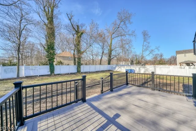 a view of a balcony with wooden fence