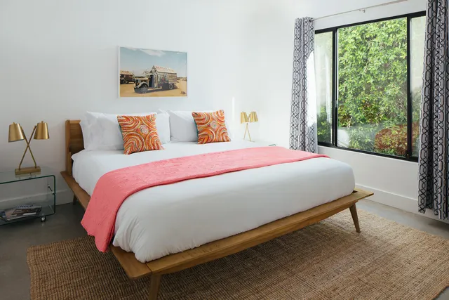 a view of balcony with two chairs and a table
